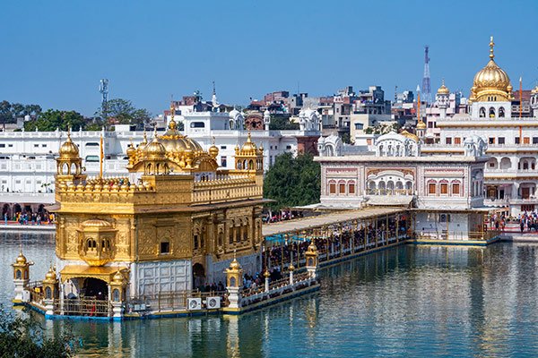 Golden Temple Amritsar view with surrounding attractions, explore Wagah Border, Jallianwala Bagh, Durgiana Temple, cultural heritage, and historical landmarks.